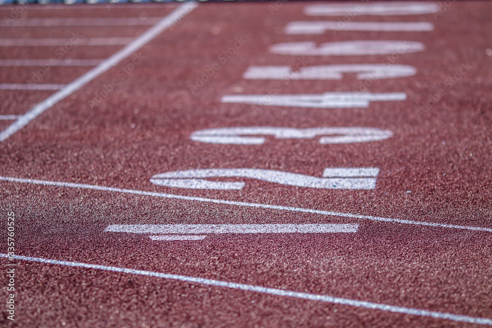 Fototapeta premium Red running sport track background and texture. Sport running track concept.