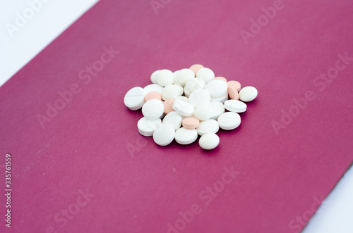 pink pills on a white background