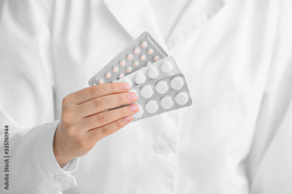 Female doctor with pills, closeup Female doctor with pills, closeup