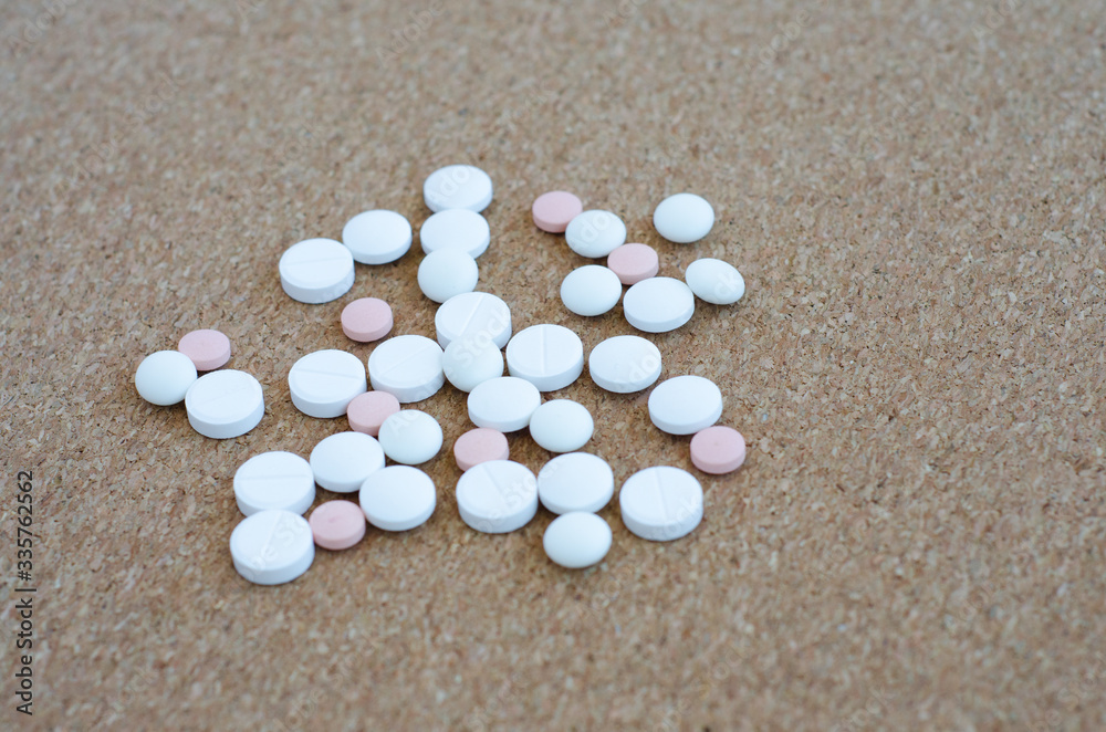 white pills on white background white pills on white background