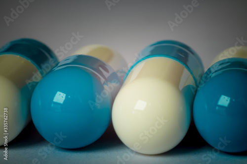 blue and white pills close-up
