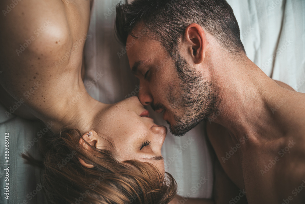 Romantic Kissing Xxx Hd - Sensual and romantic young couple kissing and making love on the bed at  home. Love concept Stock Photo | Adobe Stock