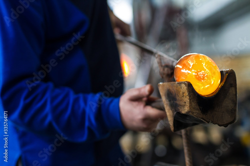 Glass crafting worker make glass souvenir