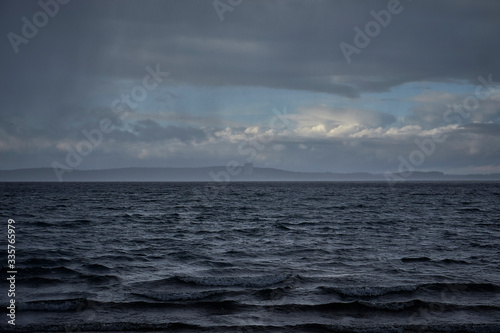 
Sea with waves and horizon with clouds