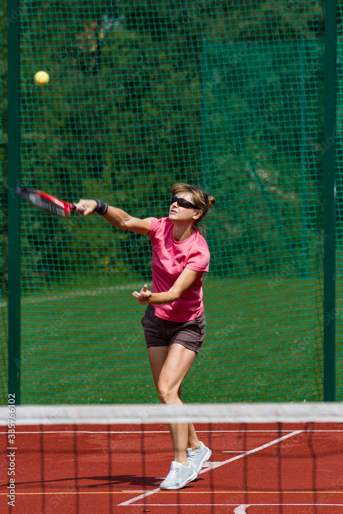 Female tennis player serving Female tennis player serving
