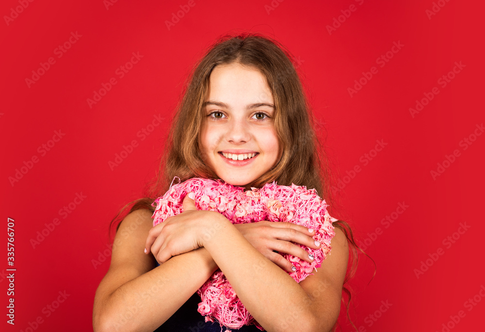 Adorable girl having fun. Romantic mood. Happy child hold heart red background. Holiday of love and care. Little girl with pink heart. Heart shaped decor valentines day. Feeling loved. Lovely baby Adorable girl having fun. Romantic mood. Happy child hold heart red background. Holiday of love and care. Little girl with pink heart. Heart shaped decor valentines day. Feeling loved. Lovely baby