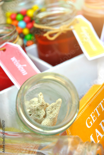 coral in a jar with sweets in the background, pre-wedding photography elements photo