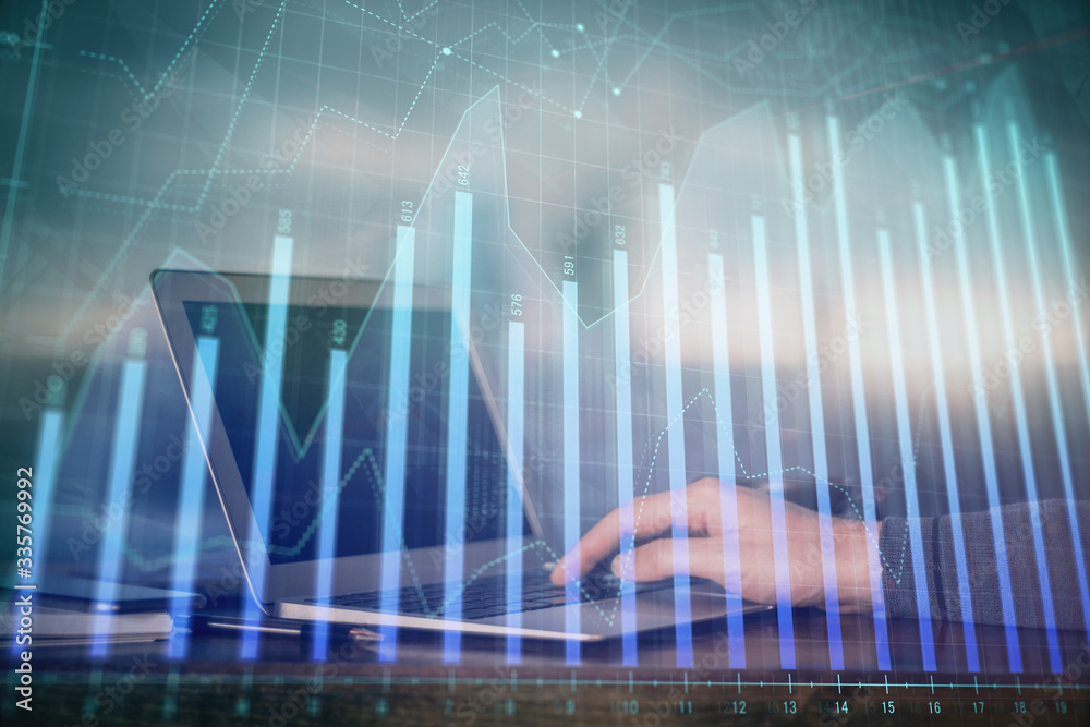 Double exposure of stock market graph with man working on laptop on background. Concept of financial analysis. Double exposure of stock market graph with man working on laptop on background. Concept of financial analysis.