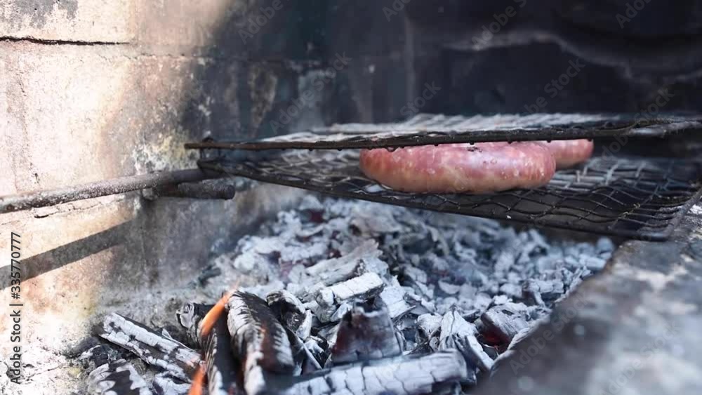 sausages barbecue on the grill cooking on the embers sausages barbecue on the grill cooking on the embers