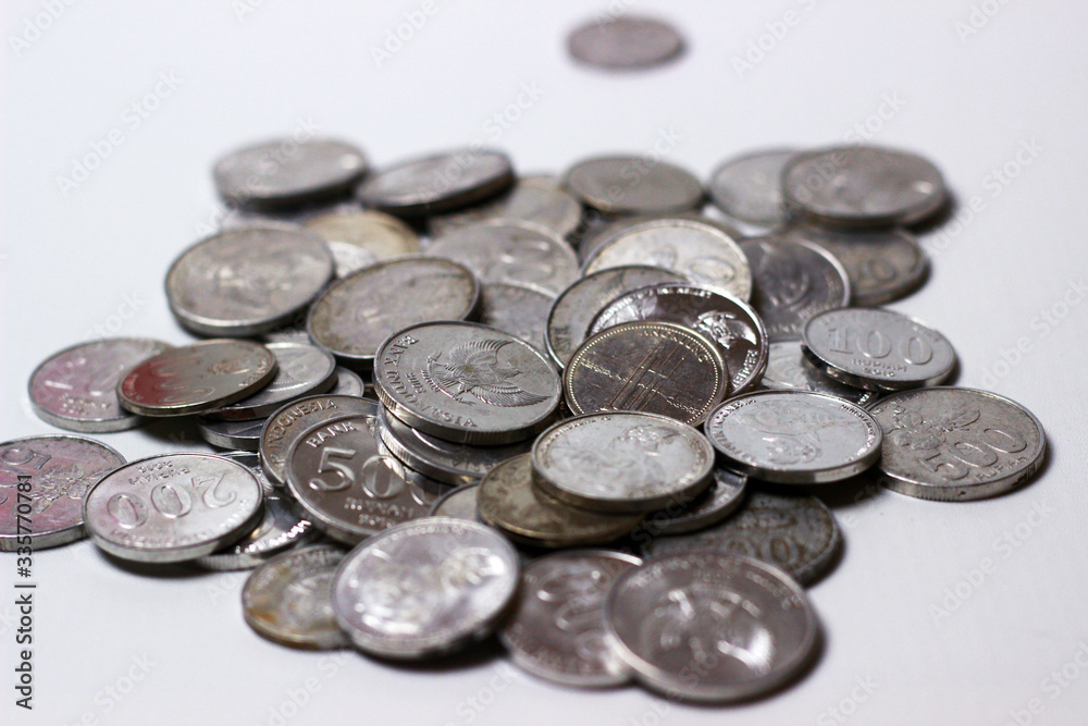 Coins scattered and overlapping. Indonesian Rupiah and isolated Coins scattered and overlapping. Indonesian Rupiah and isolated