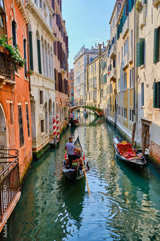 Gondolas in a narrow canal in Venice