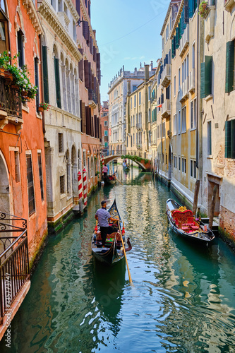 Gondolas in a narrow canal in Venice