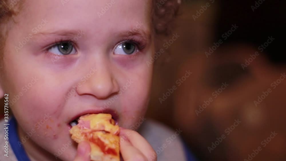 Little boy eats pizza. Portrait, close-up, slow-motion video Little boy eats pizza. Portrait, close-up, slow-motion video
