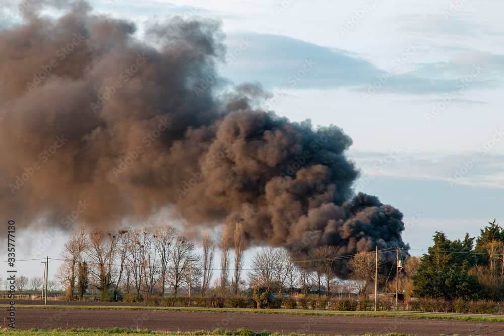 large bonfire in countryside, climate issues