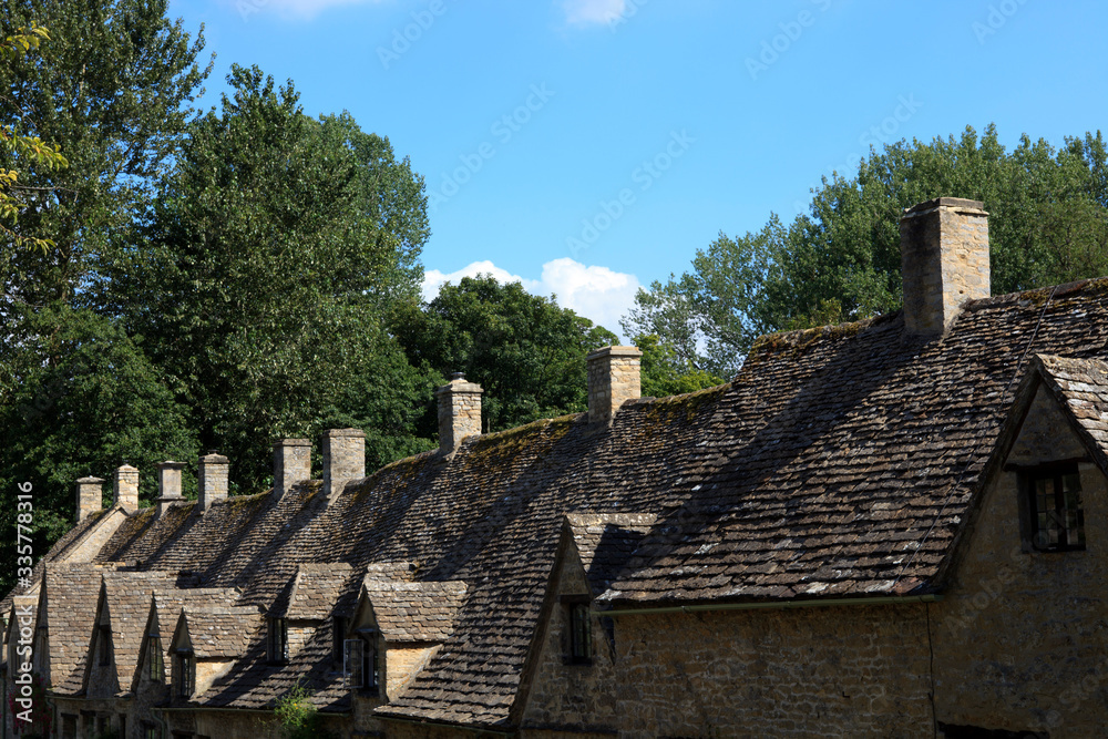 Bibury (England), UK - August 05, 2015: Bibury village view, Gloucestershire, England, United Kingdom. Bibury (England), UK - August 05, 2015: Bibury village view, Gloucestershire, England, United Kingdom.
