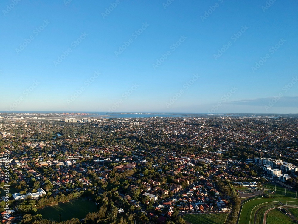 Drone panoramic aerial view of Sydney NSW Australia city Skyline and looking down on all suburbs 
