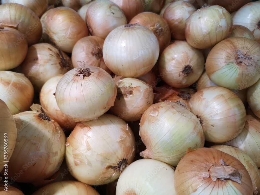 Onions vegetable are stacked on the basket for sale in the market