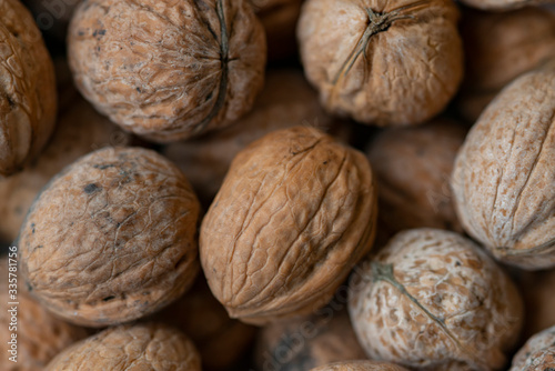 Walnuts with shells. Background of fresh walnuts.
 photo