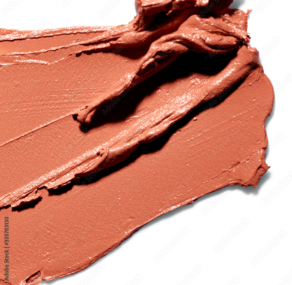Smudged makeup foundation on white background Smudged makeup foundation on white background