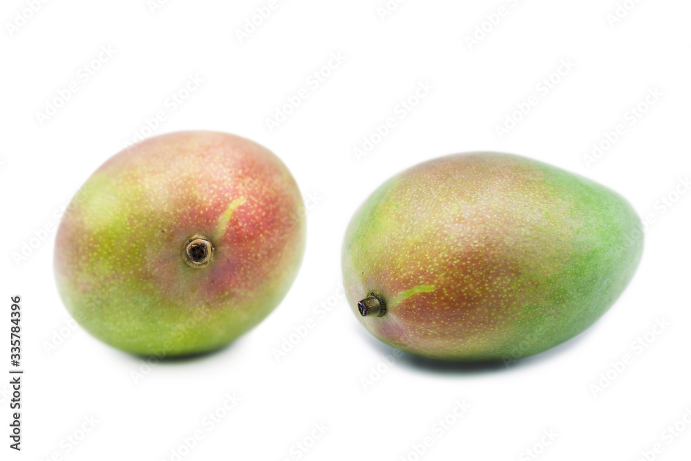Ripe organic mango fruit isolated on white background. Ripe organic mango fruit isolated on white background.