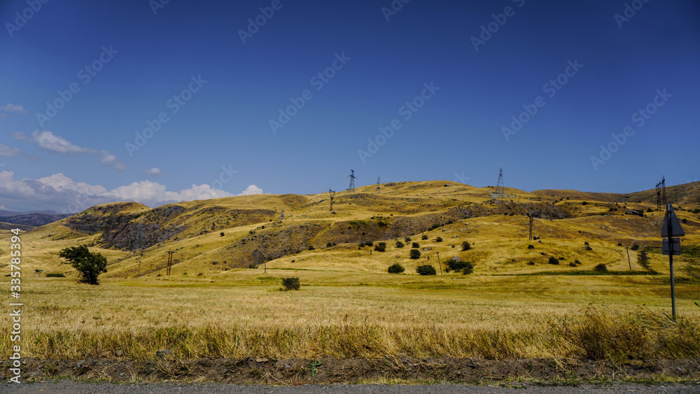 Fototapeta premium Mountain view road at sunset