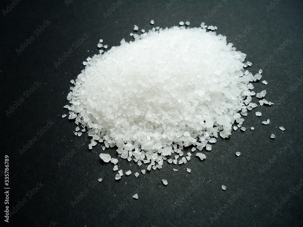 sea salt grains on dark background sea salt grains on dark background