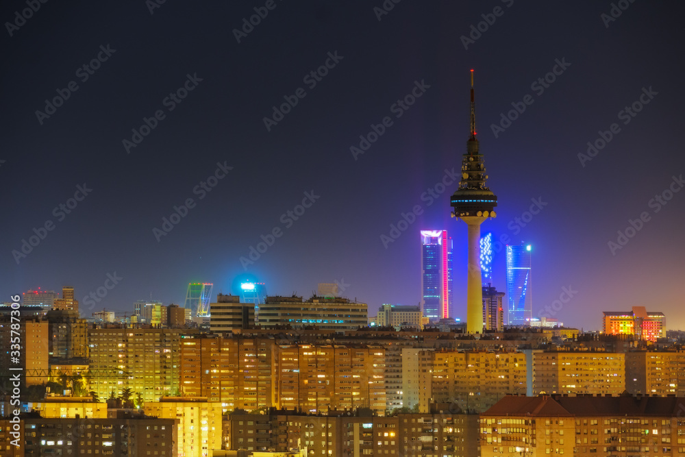 View of the skyline of Madrid, with the mountains in the background, in a beautiful sunset. Spain. City and travel concept. View of the skyline of Madrid, with the mountains in the background, in a beautiful sunset. Spain. City and travel concept.