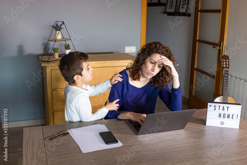 Obraz na plátně Mother working from home with a kid. Quarantine mode