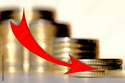 Fotografie Red arrow on the background of money