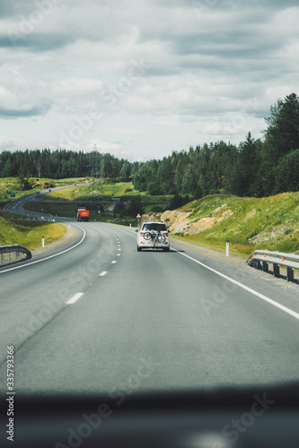 Car driving on winding road for new adventures POV