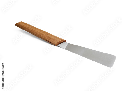 stainless spatula with wooden handle isolated on white 