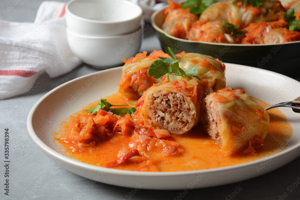 Cabbage rolls stuffed with ground beef and rice in tomato sauce Cabbage rolls stuffed with ground beef and rice in tomato sauce