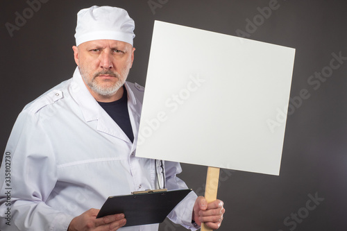 Doctor with a poster in his...