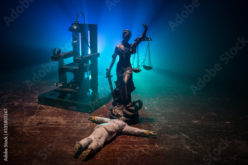 Death penalty electric chair miniature on dark. Creative artwork decoration. photo