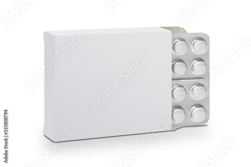Foto White tablet pills in blister packs in a white cardboard box
