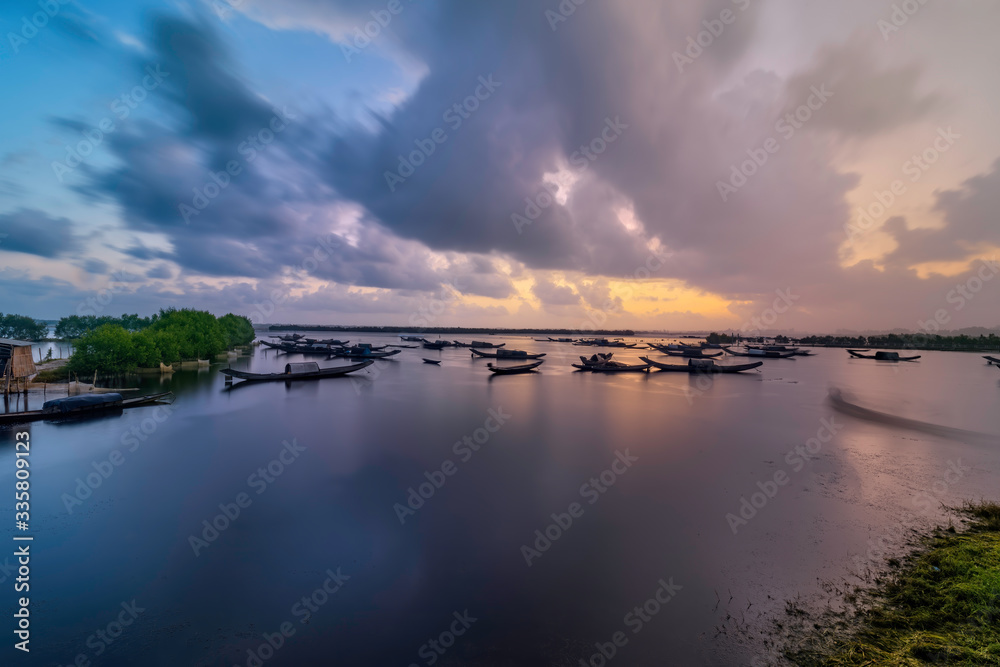 Boats in Tam Giang lagoon in sunrise in Hue, Vietnam