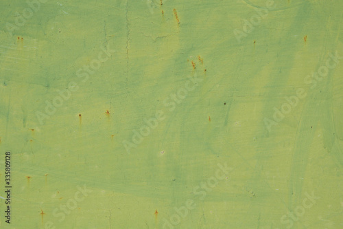 Light green background with pale stains from the brush and very small cracks. Rare rust spots on painted metal.