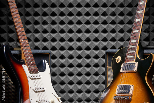 Top view of electric guitar on acoustic foam panel background photo