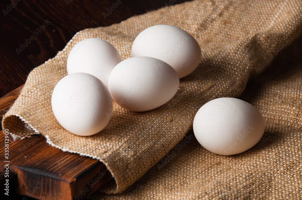 Chicken eggs on burlap, rustic still life Chicken eggs on burlap, rustic still life