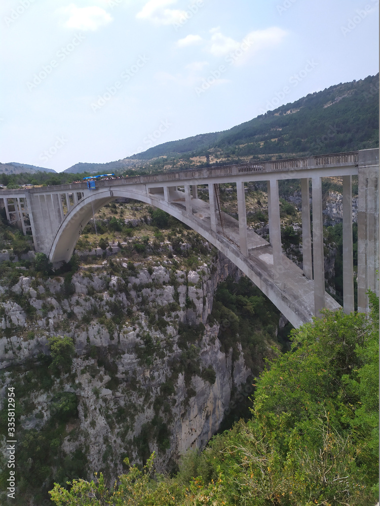 Bungy jumping from a bridge over the river