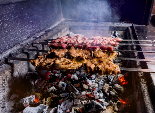 Delicious beef and pork barbecue on grill. Georgian restaurant.