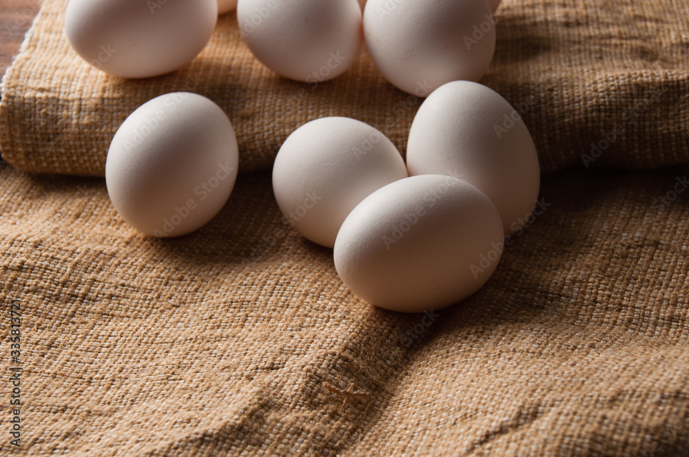 Chicken eggs on burlap, rustic still life Chicken eggs on burlap, rustic still life
