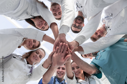 bottom view. diverse medical professionals showing their unity.