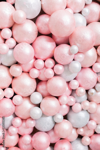 background texture of foam balloons. a wall of balloons. pink and white balloons