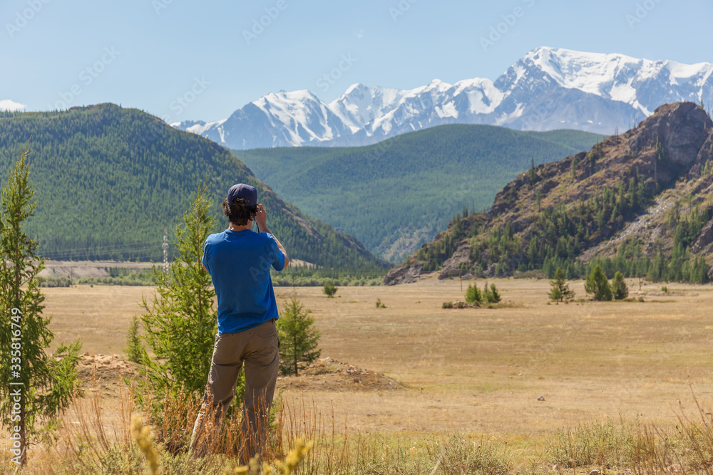 Belukha Mountain photographed by tourists. Altai. Belukha Mountain is part of the World Heritage Site entitled Golden Mountains of Altai.