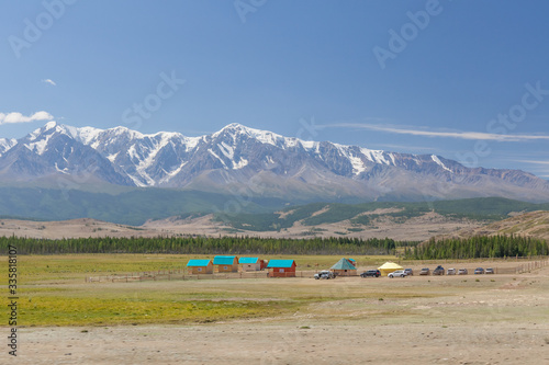 Village at the foot of Belukha Mountain. Altai Russia. Belukha the highest peak of Siberia