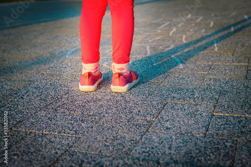 little girl playing hopscotch, kids play outdoors