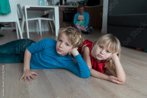 kids- boy and girl -bored staying home, family in stress