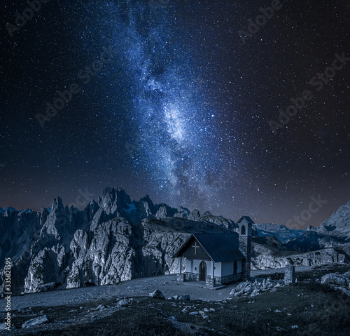 Milky wa over small chapel in Dolomites, Italy