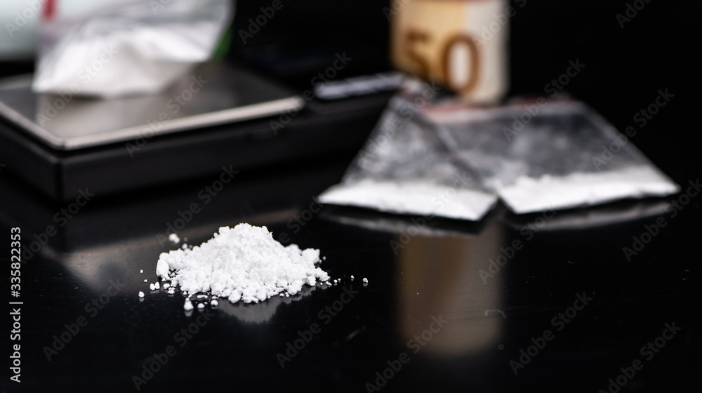 Portion of Cocaine on a dark plate (close-up) Portion of Cocaine on a dark plate (close-up)